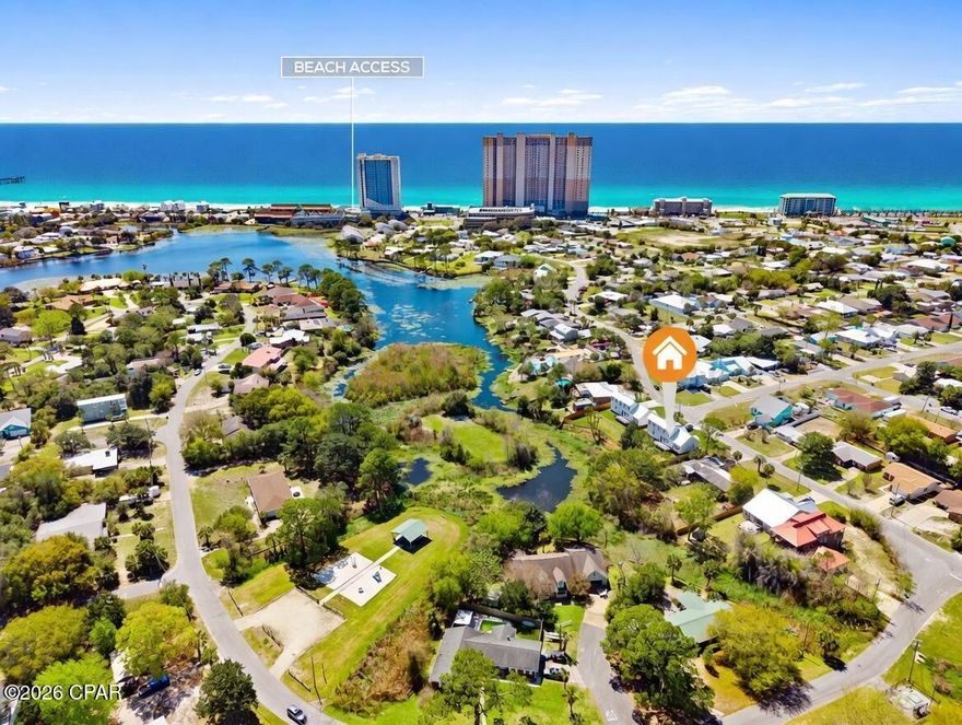 Waterfront Luxury New Construction on Lullwater Lake! Introducing an exceptional waterfront residence on Lullwater Lake, where refined design meets effortless coastal elegance. This newly built two-story home offers 1,817 sq ft of curated living space, featuring 3 generously sized bedrooms, 2.5 designer baths, and a main-level primary suite for elevated comfort and privacy. Built with quality and efficiency in mind, highlights include hurricane-impact windows and exterior doors, a Taexx in-wall pest control system, reclaimed-water irrigation, gutters, wrap-around fencing, spray-foam roof deck insulation, and dual mini-split A/C units for individualized climate control upstairs and down. An oversized 1-car garage adds extra storage and convenience. Enjoy no HOA and no flood zone, plus a prime location just a short stroll to the beach, minutes from Pier Park for dining, shopping, and entertainment, and close to the recreation and sports facilities at Frank Brown Park Includes a 1-year builder warranty and 1-year transferable termite bond. Ideal as a primary residence, second home, or long-term investment in a peaceful community (short-term rentals not permitted). Schedule your private tour today and discover waterfront living at its finest.