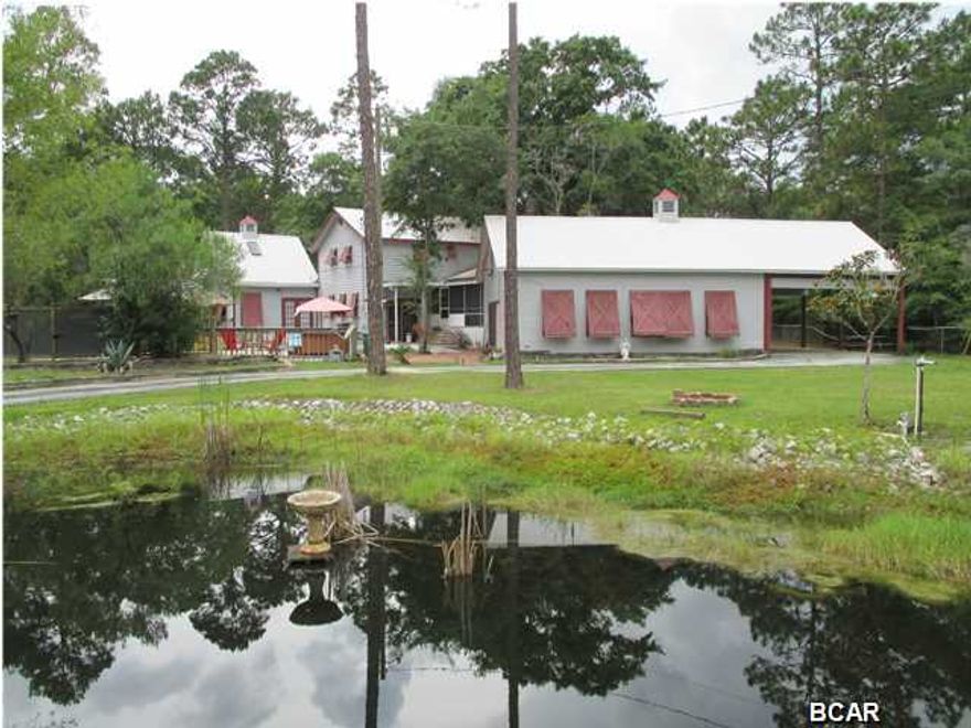 Looking for a place to raise and train your own horses and still be 10 minutes from the Mall. Look no further than this place. It has 2.39 acres with a 2 stall barn, feed and tack room and a stocked pond with catfish and coy. It is completely chain link fenced with a security gate at the entrance. Home features 6 bedrooms and 4 baths with 3000 sq feet of living space. As you enter your new property you will notice the long winding drive that continues past the pond to the home. The pond has a board walk to a gazebo where you can sit out and fish or enjoy many sunsets to come. The driveway completely encircles the home for easy access to the carport and the barn. The home features 6 bedrooms and 4 full baths. The kitchen has been completely remodeled with granite counter tops, soft close drawers, pot and wine racks in the ceiling, a pantry that has fold out shelving for more space, bamboo flooring and much more. The family room is tiled with 10 ft ceilings and the master bedroom suite has the 10 ft ceiling as well. The master bedroom has includes a large walk in closet with a spiral stairwell that leads up to a 8 X 39 heated and cooled carpeted bonus/game room that is not included in the sq footage of the home. The master bath suite is 15 X 18 with sliding Japanese Shoji paper doors with slate tile floors, tiled separate shower and an oversized whirlpool tub. This home has the wide plank laminate wood flooring throughout. All the rooms are large and storage space is everywhere and includes an indoor workshop within the laundry area. The Florida/dining room off the kitchen has a full wall of windows from floor to ceiling. This makes it possible to enjoy the outdoor views while in the heated and cooled comfort of your home. Most all of the rooms in the home are protected by a Fire Suppression/sprinkler system . Home has an in ground pool with a new in 2014 pool pump and filter. The home includes 2 HVAC systems, 2 washers and 2 dryers that convey with the sale, 2 hot water heaters and is under a termite bond. Make your appointment to see this unique property today. Too many amenities to list. Seller offering up to $10,000.00 in buyers closing cost and prepays with acceptable offer