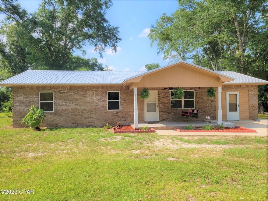 Charming 3-bedroom, 1-bath brick home on 1 acre.  Located on a paved road one mile from Falling Waters State Park. Just renovated and ready for it's new owner.  New stainless steel stove with air fryer and convection oven.  New refrigerator with ice maker and new microwave. New laminate flooring with new carpet in bedrooms. New windows, interior paint, and exterior paint.  Roof was put on in 2018. New well pump. Circle driveway. Also has an extra water/electric hook-up in the yard for an above-ground pool or an RV. New survey will be provided to buyer. Seller is a Florida-licensed real estate broker.