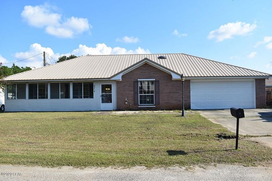 Spacious brick home on a corner property.  Neat & clean home in very good condition. New metal roof. Long enclosed front porch. Over 2600sf under roof.  Double car garage plus enlarged driveway. Airy Living Room/Dining Room.  Double french doors lead to huge bedroom in back of home, also has its own separate entrance.  All bedrooms have large walk-in closets or huge double closet.  Storage galore in this home.  Pantry room off kitchen, oversized laundry room with washer & dryer, plus a bonus room - could be a small office, TV room, playroom.   Fully equipped kitchen.  2nd bedroom has it's own private bath with shower.  Master bath has double vanities and a pocket door.   Owner has maintained this home in excellent condition.  Don't wait on this one - Call to see it today