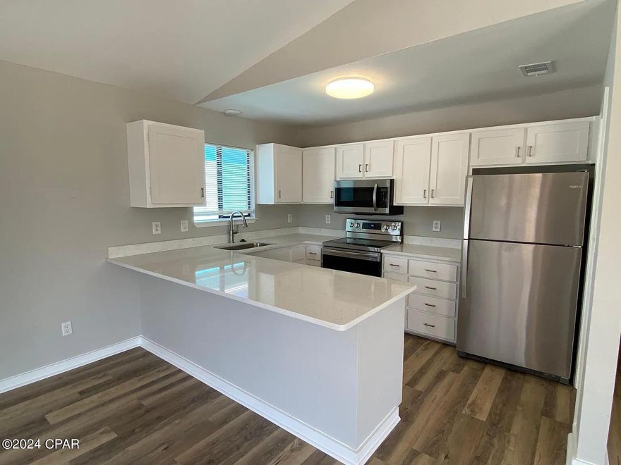 Power ($200 cap), water and trash included. Welcome to 6216 Beach Drive, where you are just walking distance to the beach! Property was just recently redone with new paint, flooring, countertops and appliances (including washer/dryer). Living area features many windows allowing an abundance of natural light. Located off the living room is a large covered balcony perfect for afternoon sunsets or Saturday cookouts with friends. Bedrooms have more than enough size with adjoining bathrooms.