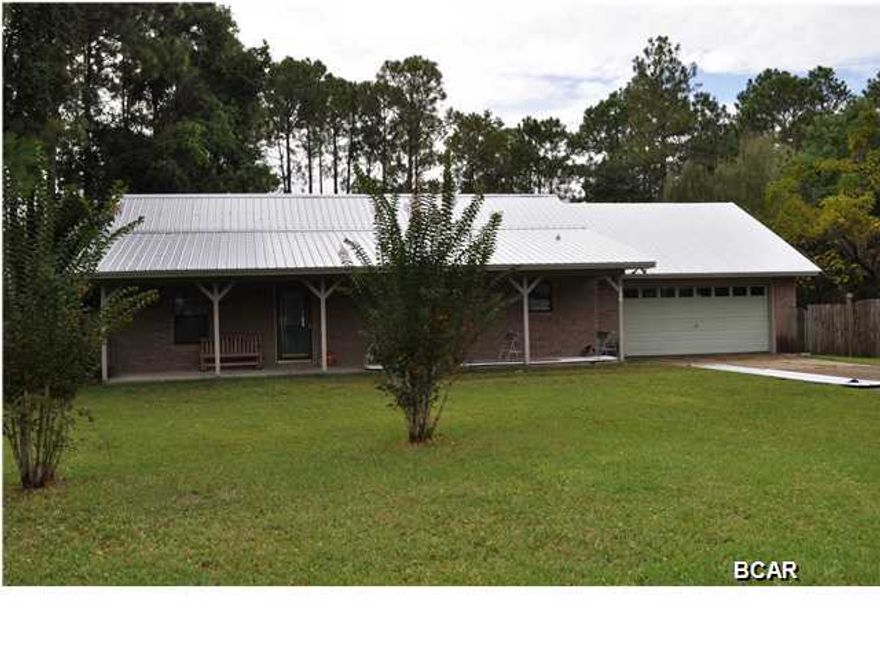 **NEW METAL ROOF JUST ADDED AND SELLER OFFERING HOME WARRANTY** This is it...the home you have been waiting for! Lots of updates and style in this 1-story Shoreline Estates home with a view of Laird Bayou. You'll love the look of the wood floors as well as how easy they are to maintain. The family epicurean will appreciate the renovated kitchen with its custom cabinetry, state-of-the-art appliances and solid-surface countertops. There's even two pantries, one with roll-out drawers for better accessibility. The home has a split-bedroom floor plan with a master suite fit for a king! Included is a hot tub in the master bath, several standard closets and a walk-in closet, and an adjoining office with French doors that open to the den. This is a floor-plan the entire family will enjoy! For