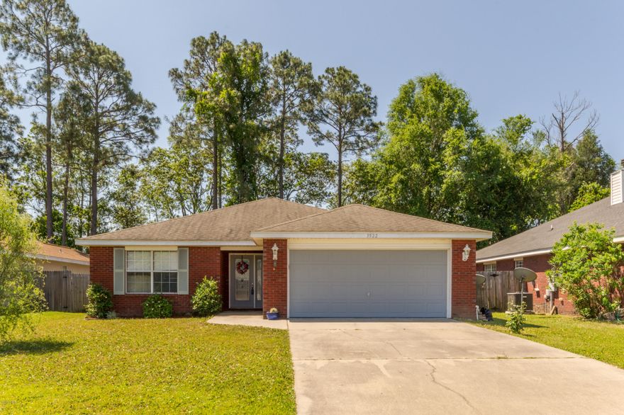 This all brick 3/2 home is located in the Brentwood subdivision and backs up to the woods. The living room offers 10' high ceilings, crown molding, laminate flooring, fireplace and French doors that lead out to the covered patio. Kitchen has ample cabinetry, large pantry, breakfast bar with pennant lights, and stainless steel appliances (except stove/oven).  There is a 2 car garage, sprinkler system, and large laundry. All sizes/info/measurements approved, please verify if important!