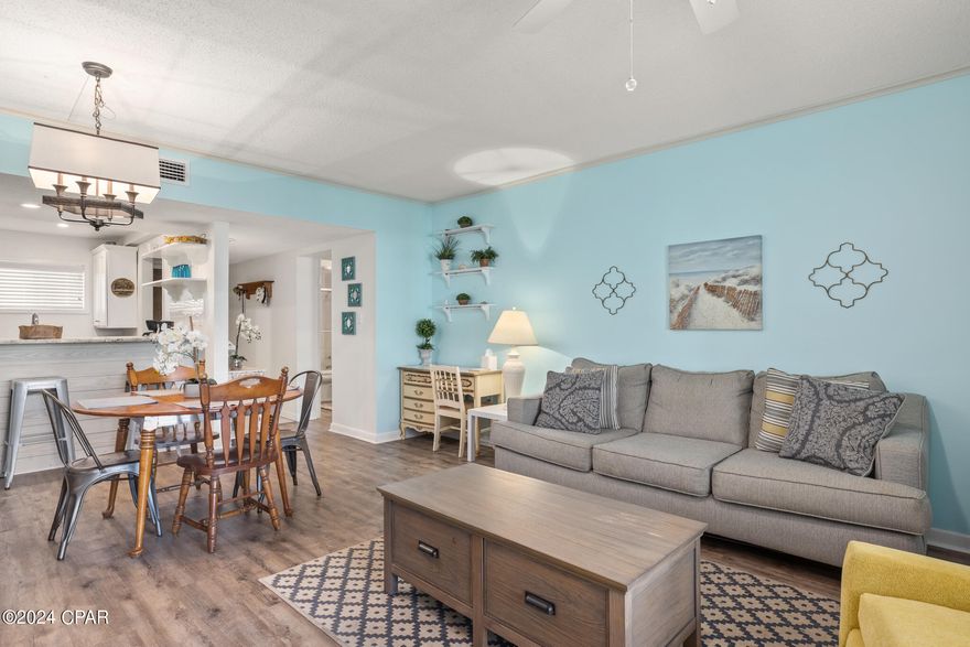 CURRENTLY UNDER CONTRACT - SELLER ACCEPTING BACKUP OFFERS. Welcome to your new home in the heart of Panama City Beach! This charming and fully furnished 2-bedroom, 2-bathroom ground floor end unit offers the perfect blend of comfort and tranquility. Designed for long-term residents, this condo is part of a resort-style community nestled on a pristine golf course, complete with a refreshing pool for those warm Florida days.

The interior boasts an updated kitchen with stainless steel appliances, complemented by modern LVP flooring throughout the living spaces. The large main bedroom is a true retreat, offering ample space and privacy. Step outside to your screened-in patio, where you can enjoy your morning coffee or unwind after a long day while soaking in the natural light that fills the space.

This condo is perfect for those seeking peaceful, resort-style living just minutes from the best Panama City Beach has to offer. Located only two miles from Pier Park and one mile from the stunning emerald beaches, this beautiful property is not to be missed!