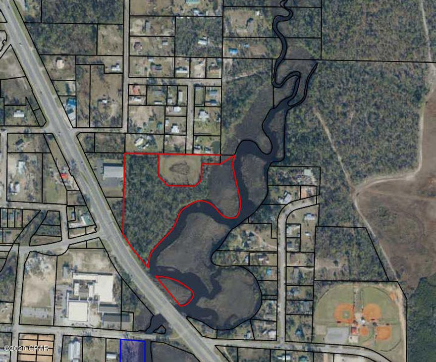 Vacant parcel along busy Highway 77.  Waterfront on Fanning bayou.  Parcel is approximately 11 acres.  Survey is required to determine exact property area and uplands area.