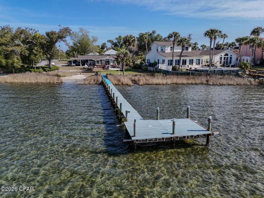 Open House Saturday April 3rd 11am-2pm Motivated Seller! Charming Florida Home on Parker Bayou with unobstructed Waterfront Views. Welcome to your own slice of paradise! Nestled at the end of W Park Street on the corner of E 6th Street, this beautifully updated Florida home offers breathtaking views of Parker Bayou at the mouth of Pratt Bayou. With direct access to the water, you can park your boat or jet skis at your private dock and be cruising to Shell Island or enjoying a casual waterfront meal at Bayou Joe's in minutes. This 2,469-square-foot home features 3 spacious bedrooms and 2 full baths with water views from most rooms, blending historical Florida charm with modern updates. Inside, you'll find a large family room and a Florida room?both with stunning water views.  Make your appointment today!