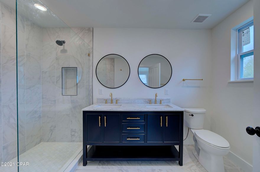 **CURRENTLY UNDER CONTRACT, SELLER ACCEPTING BACK UP OFFERS**    This home has been completely renovated with modern features while maintaining its original charm. No expense was spared with the new open floorplan! This Includes the original hardwood floors, new roof and all new windows! Also features all new plumbing & wiring, insulation, drywall, and the list goes on! You do not want to miss this rare opportunity to own this gorgeous home on a quarter acre lot with alley access! Seller is the listing agent.  All measurements are approximate, please verify if important.