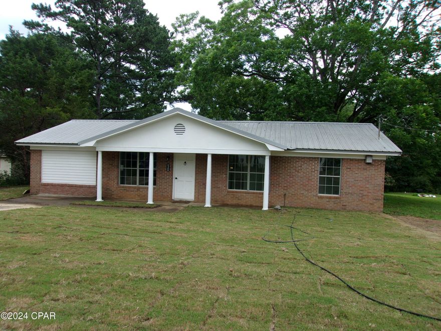 Inviting and Spacious 4 Bedroom 1.5 Bath Brick Home on almost half an acre. New paint throughout. Open concept to living room, dining room and kitchen. Nice laminate flooring throughout. Completely new air conditioning system in 2021. New metal roof in 2020. Has concrete driveway and walkway. Nice and quiet area. Conveniently located for easy shopping, eating and access to Interstate 10 and 4 Lane Highway that leads to the world's most beautiful beaches in Panama City, Florida. This home is ready and waiting for a new family. Check it out today!!!!