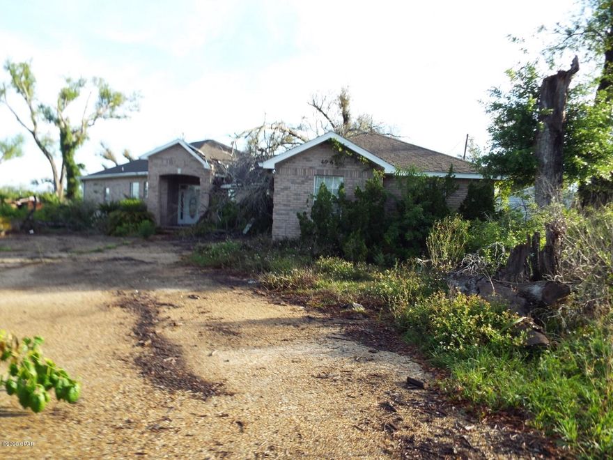 All Brick, newer Thee  bedroom two and half bathroom house with two car garage, on Martin Lake, needing some TLC offered as is.  All sizes are approximate please verify according