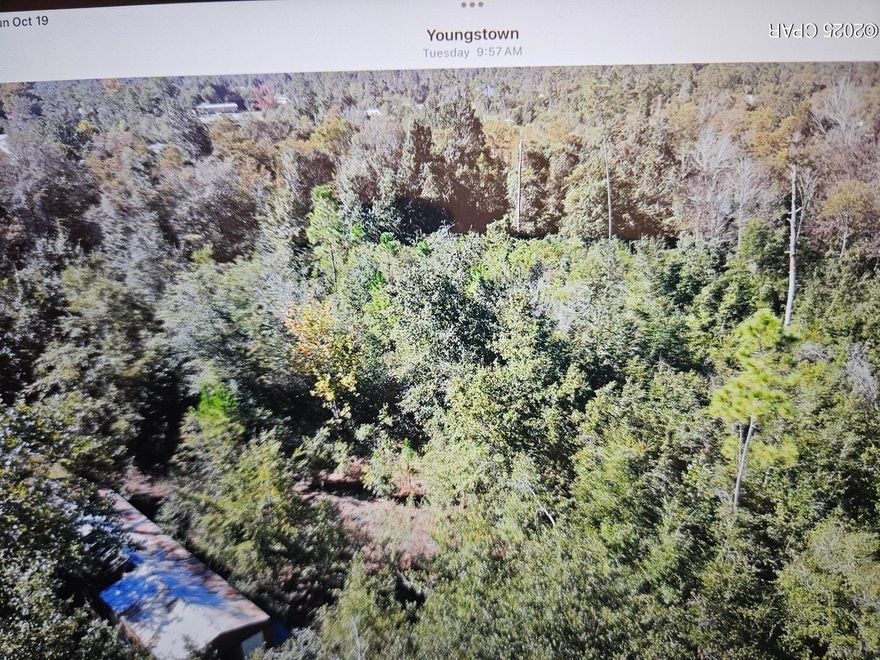 Large 1.4 acre lot, mostly wooded with some clearing, there is a mobile home on the property. buyer to determine the value.