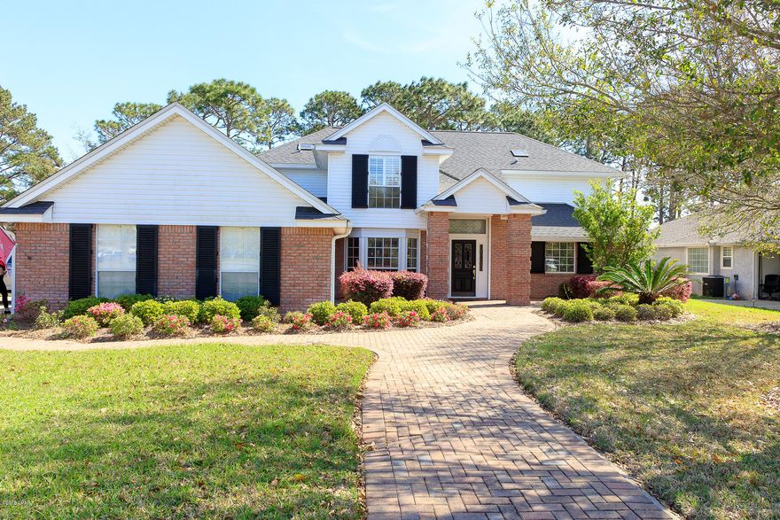 STUNNING CORNER LOT HOME IN THE PANAMA COUNTRY CLUB!  THIS HOME OFFERS IT ALL! INTERIOR FEATURES INCLUDE, ALL TILE AND LAMINATE WOOD FLOORING, NEW PAINT, UPDATED CABINETS WITH WINE FRIDGE. SPACIOUS LIVING ROOM WITH WOOD BURNING FIREPLACE AND HIGH CEILINGS. THE MASTER SUITE IS OVERSIZED AND HAS A BEAUTIFUL EN SUITE BATHROOM WITH DOUBLE VANITY AND DOUBLE WALK IN CLOSETS. THE UPSTAIRS HAS 3 LARGE BEDROOMS AND 2 FULL BATHS. ADDITIONAL INTERIOR FEATURES INCLUDE AN ELEGANT FORMAL DINING ROOM COMPLETE WITH CROWN MOLDING AND AN ABUNDANCE OF NATURAL LIGHT FROM THE BEAUTIFUL BAY WINDOWS! EXTERIOR FEATURES INCLUDE LARGE CORNER LOT ON CUL-DE-SAC, BRICK PAVERED CIRCLE DRIVEWAY, 3 CAR SIDE ENTRANCE GARAGE , SALT WATER IN GROUND POOL WITH SCREEN ENCLOSURE, SPRINKLER SYSTEM WITH SEPARATE IRRIGATION METER YOU WILL LOVE THIS HOME OVER LOOKING THE GOLF COURSE! CALL TODAY TO SCHEDULE  YOUR OWN PRIVATE SHOWING APPT.