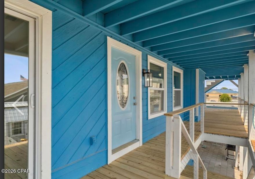 **REDUCED** SHORT SALE OPPORTUNITY-- Prime Panama City Beach Location! Unlock the potential of this spacious, multi-level beach home zoned for short-term rentals. The ground level offers a private-entry studio apartment with full kitchen and bath, perfect for guests or rental income.
The main residence comfortably sleeps 10 and features two primary suites with ensuite baths, open-concept living area, and kitchen with quartz countertops and a large island/breakfast bar. The top floor adds two bunkrooms and an additional full bath, ideal for kids or overflow guests. Wide wraparound balconies on both main levels overlook Treasure Island Marina and Captain Anderson's, plus a sun deck where you can watch the fishing fleet return at day's end. Most of the improvements made to the home, including roof, HVAC, kitchen(s), and baths have been done since 2021. Some cosmetic touch-ups could bring this property to its full potential. It is a unique OPPORTUNITY to score a great deal on a primary residence, vacation retreat, or income-producing investment on the beach. THIS IS A SHORT SALE. ALL OFFERS ARE SUBJECT TO THIRD-PARTY APPROVAL.