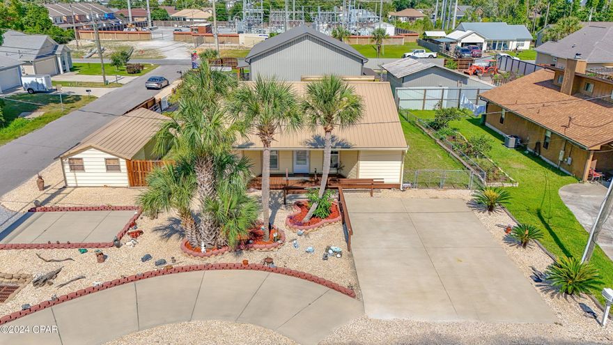 Under Contract and Taking Back up offers with a 72 hour Kick out Clause! 
WOW! Possible Seller Financing!!  Take a look at this charming and newly remodeled beach cottage near Beaches, shopping, and restaurants.  Home is located on Thomas Drive near the Navy Base, and Bay Point and in a very quiet neighborhood.  Home sits on a corner lot and fully remodeled with new metal roof, new exterior and interior paint, new siding, new flooring, and new kitchen with stainless steel appliances.  Large living room with crown molding throughout, and abundance of natural lighting.  You have a bonus room that was added as a family room or game room.  Exterior of home is fully fenced with a large custom-built Gazebo.  Custom gutters throughout, and exterior security cameras.  Plenty of exterior parking with additional space and circular driveway. Landscaping is manicured. You have another carport for your boat etc and exterior workshop.  At $319,900, this home will not last long on the market.  Seller financing with 25% down, easy terms.