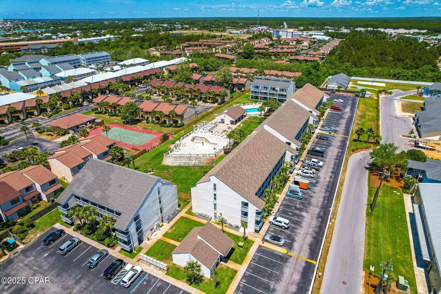 SELLER FINANCING AVAILABLE!  Unique two story 2 bedroom and 2 bath unit, with washer and drier,  in the desirable Endless Summer Condominiums on the west end of the beach and immediately across Front Beach Road.  First floor has the master bedroom with full bathroom tub/shower.  On the second floor is the additional bedroom/loft with a full bathroom and closet space.  There is a stack able washer and drier which comes with the sale.  The deck outside has beautiful views overlooking the pool and sunsets.  This complex has two pools, a hot tub,, exercise room, bbq grills, and shuffle boards. The public beach access is right across the condos.  Plenty of parking for owners and guest.  Close to Pier Park, airport, 30A and Seaside.    Being sold Furnished and ''As Is''.  This unit is a great Short term rental with average per day during slow months at $115 - $125 and peak summer at $155- $198..  Great vacation home and rent it out when not in use.  Golf cart friendly.