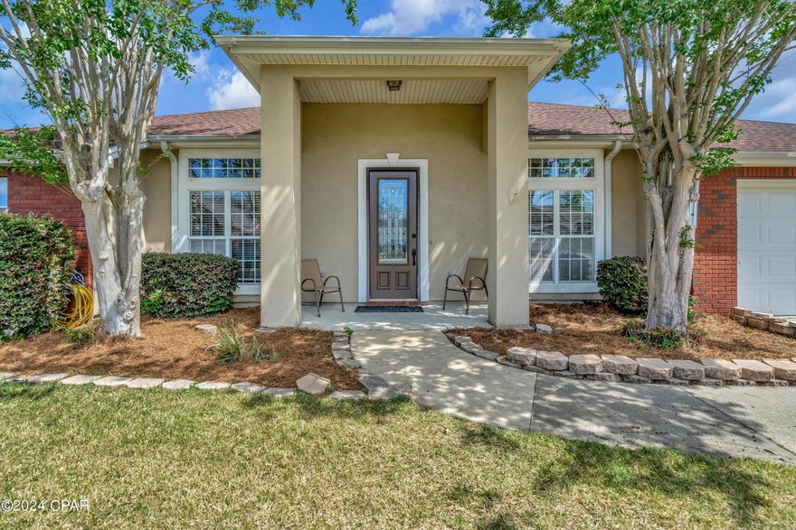 Schedule now to view and fall in love with your new home located in ''THE HAMMOCKS'' TODAY! Your new home features 4 bedrooms, 3 bathrooms, and 3 way split floor plan with LVP flooring and some tile throughout  (no carpet)! This ranch style home boast an open floor plan high ceilings featuring large crown moulding, formal dining, and two additional living spaces! The kitchen comes equipped with new stainless steel appliances( Fridge/Microwave 2024), pantry complete with shelves, and a perfect spot for a coffee bar casual dining. Enter your own personal oasis through french doors to entertain  in style on the back porch complete with fully screened enclosure featuring your heated in-groung pool and spa! This well maintained pool and spa combo has a beautiful waterfall  feature and other special features like multiple colored light settings to play with after dark!Exit the screened enclosure to additional backyard space complete with shared fence and specially planted Zoysia grass(also planted in the front yard). Move in worry-free with a new water heater (2024) newer roof, and A/C (2019).All of this, Perfectly located in the heart of Lynn Haven. Welcome Home!