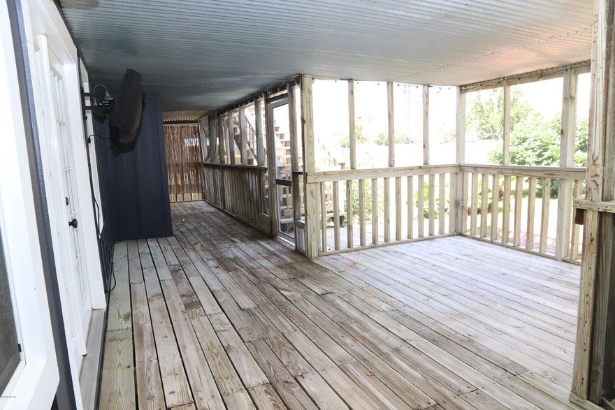 CURRENTLY UNDER CONTRACT, SELLER ACCEPTING BACKUP OFFERS.   $50,000 Price Reduction!!   VACANT AND EASY TO SHOW.   This is a super cute beach home ONLY 1 BLOCK TO THE BEACH.   2BD with an office that could easily be converted into another bedroom.  Real Hardwood floors and real hardwood shiplap on ceilings.  Double oven, updated kitchen, TONS OF OUTDOOR LIVING.  Decks wrap around almost the entire home.  FULLY FENCED and NICELY LANDSCAPED in back.   There is a large brick firepit out back as well as a large garage/out building.  SUPER CLOSE TO THE BEACH.  Outdoor shower.  Termite bond is transferable and good for 1 full year.  You need to make sure that you get in and see this one in person.  ------ Click on ''More'' for Additional Details---------- 1779 Square feet heated and cooled
1400 Square feet screened in back porch/upper deck
12 x 20 Detached garage/workshop with electricity, porch, and 2 lofts accessible by library ladder (could easily be transformed into guest house) 
All original hardwood floors from the old Petticoat Junction Train Depot; Saltillo tile in guest bed/bath.  Jet tub in master, solid surface counters in kitchen with integrated sinks. Tongue and groove pine ceilings downstairs. Cedar lined wall in large laundry room. Large master walk-in closet; Numerous attic  storage closets upstairs.  Privacy fence in backyard with gates on both sides. Large custom brick firepit and patio in backyard. Walk to beach 2 blocks  2 public access points at end of Cobb Road.
2 RV hook-ups (30 Amp service, water and sewer hook-up in carport area and 30 amp service and water in gravel parking area) 
Irrigation system on private well
Wired security system (unmonitored)
Big circular drive with gravel overflow parking.
New 40 year roof December, 2017 with transferrable warranty 
Hardiboard siding (replaced the original cedar board and batten in 2017)
Upper deck PT wood and joists replaced in 2014