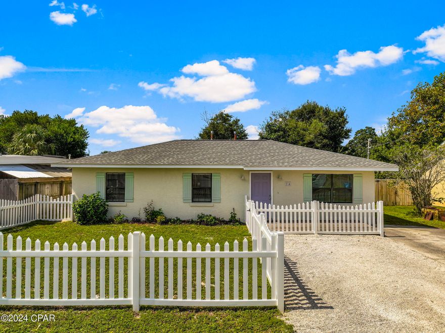 **CURRENTLY UNDER CONTRACT, SELLER WILL CONSIDER BACKUP OFFERS** Welcome to 214 Wisteria Street - your new Beach Home just half a mile from the beautiful white sand and emerald waters of Panama City Beach! Located on a quiet road, tucked back in an established neighborhood, & not zoned for short term rentals, come experience the peacefulness this ''white picket fence'' home provides.

Solid block construction, this home has been remodeled with brand new luxury waterproof vinyl plank flooring, fresh paint throughout, and blinds. In 2019, a new water heater, all kitchen appliances, and new cabinetry were installed, with a new HVAC & Roof right behind those in 2020.

Featuring 3 bedrooms, 2 full bathrooms, & an open floor plan between the living spaces, this home makes use of every inch with a nice-sized pantry & laundry room as well. Step out back to your fully privacy fenced backyard with an open patio & deck to entertain. With a little vision, you can create your own custom oasis. A shed at the rear of the property provides storage for all of your lawn maintenance needs. Schedule your tour today!