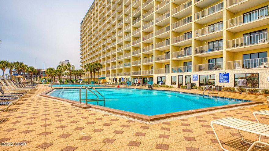 This Condo unit is right on the ground floor!

It's within walking distance of restaurants, amusement parks, golf courses, and more. Grills are provided on site. There is also a TIKI bar in the pool area and Bikini Bobs Grill!

There is 2 large pools, as well as both indoor and outdoor hot tubs!

The master bedroom has a king size bed and a large TV. It has private access to the bathroom. The hallway has 2 twin size bunk beds. The living room has a QUEEN size sleeper sofa, a large flat screen TV.

New hot water tank and newer HVAC system.