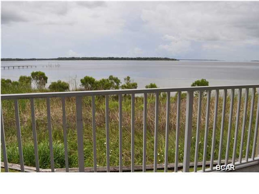 Fantastic waterfront townhouse in the historic Cove district of Panama City. You'll love watching the sun set over St. Andrews Bay from the balcony of this Grand Bay Townhome. Great floor plan with lots of space; the two bedrooms are on the top floor and each one has a private bath. There is a half bath on the second level along with the living areas and kitchen. The ground floor is an all concrete block garage with a covered patio off the back. Additional amenities include a fire sprinkler system and hurricane shutters. You can take a short stroll to the downtown district where you'll find specialty and antique stores and many restaurants. Got a boat? Panama City Marina is just around the corner. Keep your boat docked there and launch it anytime you like for your trips to Shell Island