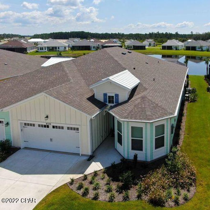 Its 5 o'clock Everywhere in LATITUDE MARGARITAVILLE WATERSOUND! This popular 3 bed 2 Bath NEVIS is available with pool, spa, and covered lanai overlooking a large pond in back. No need to wait on a list for this model when everything you need is done and move in ready. Everything in this home is upgraded including quartz counters, touches of gold kitchen cabinet handles and faucet, epoxy sealed flooring in garage, stairway in garage for extra storage, lighting in all closets, 8' doors throughout.  All tile surfaces on floors and bathrooms professionally sealed. Deep(24'') cabinets for extra storage in laundry room. Extra Cable and electric sources through the home. Pavers in the pool area have been sealed and an Automatic Keep-Fill is a bonus to assure proper water level in the pool/spa