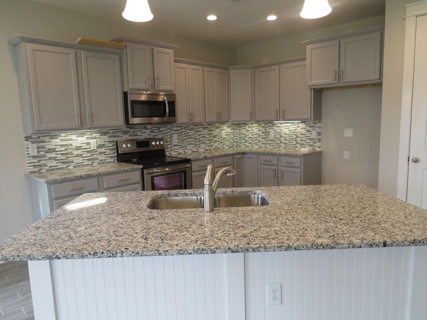 This home has a Cobia Floor Plan with a Carolina Elevation. This house is a new construction Model Home Example and not the actual house being built. A Samuel Taylor built home includes standard features such as designer carpet in main areas and bedrooms, 8 ft. 2 panel craftsman interior door package, brushed nickel fixtures and faucets throughout, insulated (R19) interior common walls and insulated (R38) ceilings, and durable Sherwin Williams premium interior wall paint. Kitchen features stainless steel appliance package (range, dishwasher, & microwave) and oversized 36'' wood cabinetry with crown molding, and granite counter tops. Full bathrooms include raised vanity heights, large tile flooring in bathrooms and laundry rooms, 2 x 6 Exterior Wall Construction, and hurricane tie down rod anchor system. Exterior of home includes coastal and craftsman architecture, spacious 2 car garage, architectural roof shingles with an extended warranty, low maintenance aluminum fascia and vinyl soffits, termite treated foundation, Hardi-Plank siding with an extended warranty, and durable Sherwin Williams Loxon exterior paint. All new construction homes are backed by a 2-10 Home Buyers Warranty. Your HOA dues includes lawn maintenance for the home. The Whisper Dunes subdivision includes sidewalks, curb & gutter, a beautiful community pool and pool cabana. Whisper Dunes is a golf cart friendly community and you are within a short driving distance to our beautiful beaches, Pier Park shopping, NW FL Beaches International Airport, and the beautiful 30A South Walton area. Choose your lot, floor plan & elevation, choose your design options, and pick your paint colors! All measurements and sizes are approximate, please measure for accuracy and verify all sizes.