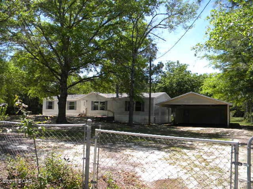 Almost 1800 sq ft, 4 br, 2 ba home on an acre with a pond, fenced yard, double carport with a 1 car garage and workshop area, living room with fireplace along with a separate den, split floor plan, needing your personal touches to make it shine.  You will want to see this one quick so call now.