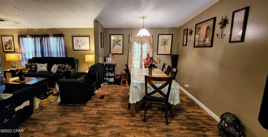 Enjoy the sounds of nature and beautiful pond view from this spacious 3 bedroom/2 bath home on over 8.5 acres! The HVAC was recently replaced to keep things cool. The cabinets, countertops, and floors were updated 8 years ago and have been well-maintained. There is a creek that runs through the property and the ponds contain catfish, bream, and crayfish. There are mature citrus and pear trees. Bring your chickens or goats. In-person and virtual showings are available!