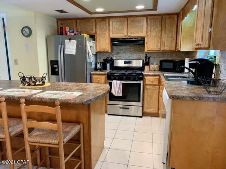 Age, SF, and dimensions approximate. Very nice unit close to the beach walk. End unit with tile floors downstairs. Backs up to pond. Complex has 11 pools to include clubhouse with pool on the beach. Gated community and pet friendly.