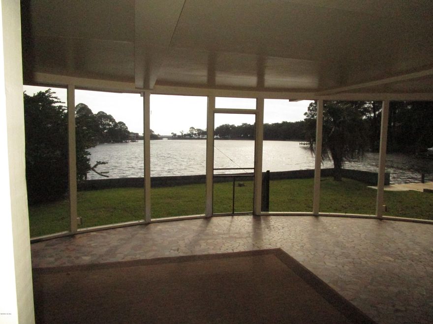 WATERFRONT HOME DIRECTLY ON JOHNSON BAYOU WITH RIPARIAN RIGHTS OUT IN THE BAYOU ** LOCATED ACROSS FROM THE PARK IN THE AREA WHERE THE DUCKS ARE LOCATED ** THE MOST FANTASTIC PART OF THE HOUSE IS THE LARGE SCREENED BACK PORCH WITH TILE FLOORS** THE HOUSE WAS IN THE PROCESS OF BEING UPDATED WHEN THE HURRICANE HIT ** THE HOUSE IS NOW GUTTED AND NEEDS TO BE PUT BACK TOGETHER AGAIN ** ROOF HAS BEEN REPLACED ** CALL LISTING AGENT FOR FURTHER INFORMATION