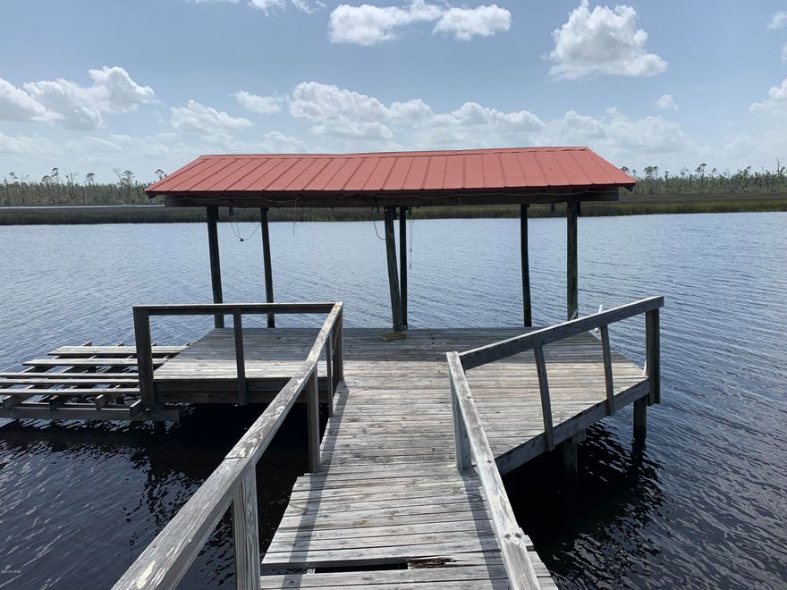 Gorgeous, picturesque setting on the high bluff overlooking Sandy Creek. If a house is built on site, CCR requires minimal 3000 sq ft home to be built. Deep water at your doorstop where the fishing is awesome! Bring your boats, your watercraft, your water aircraft, your RV, and your dogs! This is a sanctuary of a location where you won't be bothered AND you will be amazed at the natural beauty at your doorstep with endless recreational possibilities! Don't miss this amazing opportunity.