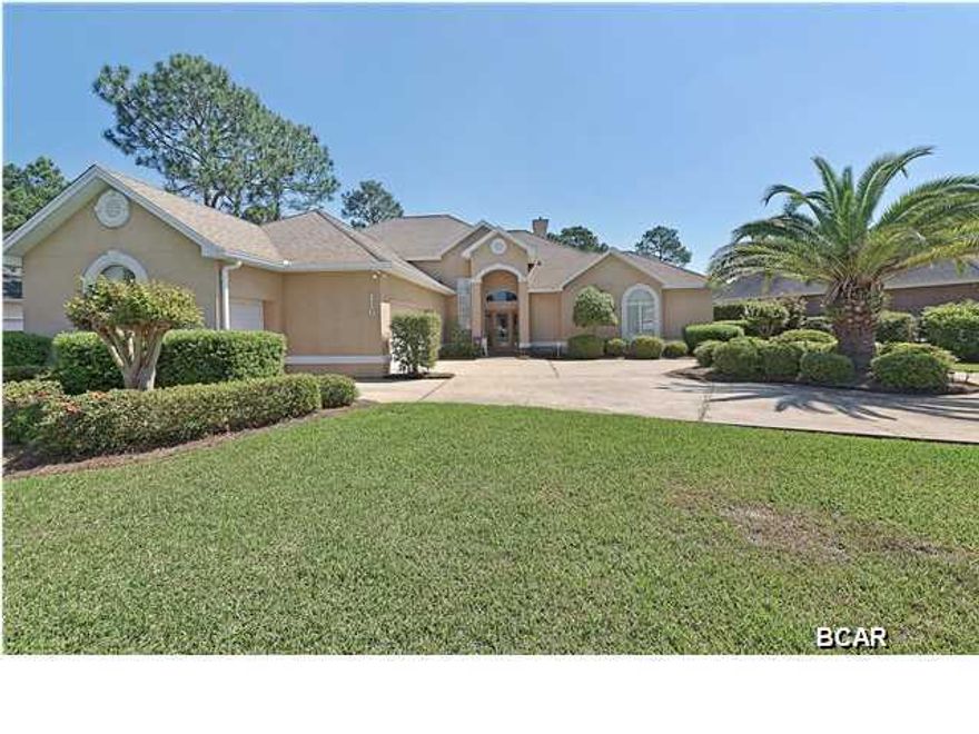 GOLF FRONT PROPERTY!!! Here is your opportunity to own a grand home on the Hombre Golf Course with views of the 4th Hole. This immaculate home has been well maintained and is made for entertaining with a wet bar and a floor plan that flows throughout and out to the screen in patio and pool. Enjoy yourself by the fireplace in the winter or a splash in the pool to cool off in the summer. Open floor plan, lots of storage with walk in attic and garage with huge closets. This private retreat is perfect for watching the golfers or the wildlife in this lush environment with a view of the pond. Oversized two car garages with separate golf cart garage, Hardwood floors in kitchen and dining, double vanity, two walk- in closet, garden tub and separate shower in the Master with so much more.