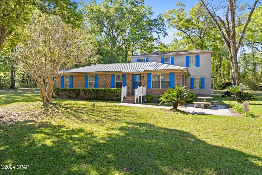 ***This house is shown by appointment only as this is private property.  Access without an appointment is considered trespassing.***
Welcome to your future home in the heart of Chipley! Nestled within the city limits, this two-story home sits on a spacious lot adorned with mature trees, offering a serene retreat with convenience to the downtown shops and restaurants.

This property is brimming with potential, awaiting your personal touch to transform it into your dream home. Step inside to discover a generous layout with ample living space, perfect for both relaxation and entertainment.  The front part of the home has undergone numerous renovations, including fresh paint on the interior and exterior, renovated baths, new laminate flooring, and a new water heater, providing a comfortable and inviting atmosphere. 

The main level features a master bedroom with a convenient half bath, offering comfortable living arrangements for those who prefer single-level living. Meanwhile, the second story holds promise with a master suite boasting two walk-in closets and a charming balcony, offering a private sanctuary to unwind after a long day. While the master bathroom and bedroom await renovations, envision the possibilities and make this space truly yours.  Please note that no appliances are included in the sale and home is being sold in AS-IS condition.

An open concept kitchen and dining area flow seamlessly into a large family room, creating an inviting atmosphere for gatherings and everyday living. With a little TLC, this home has the potential to become a cherished gem in the neighborhood.

Don't miss out on the opportunity to make this your forever home. Embrace the potential, live in the front part of the home while completing renovations, and let your imagination soar. Schedule a viewing today and unlock the possibilities that await in this charming residence!