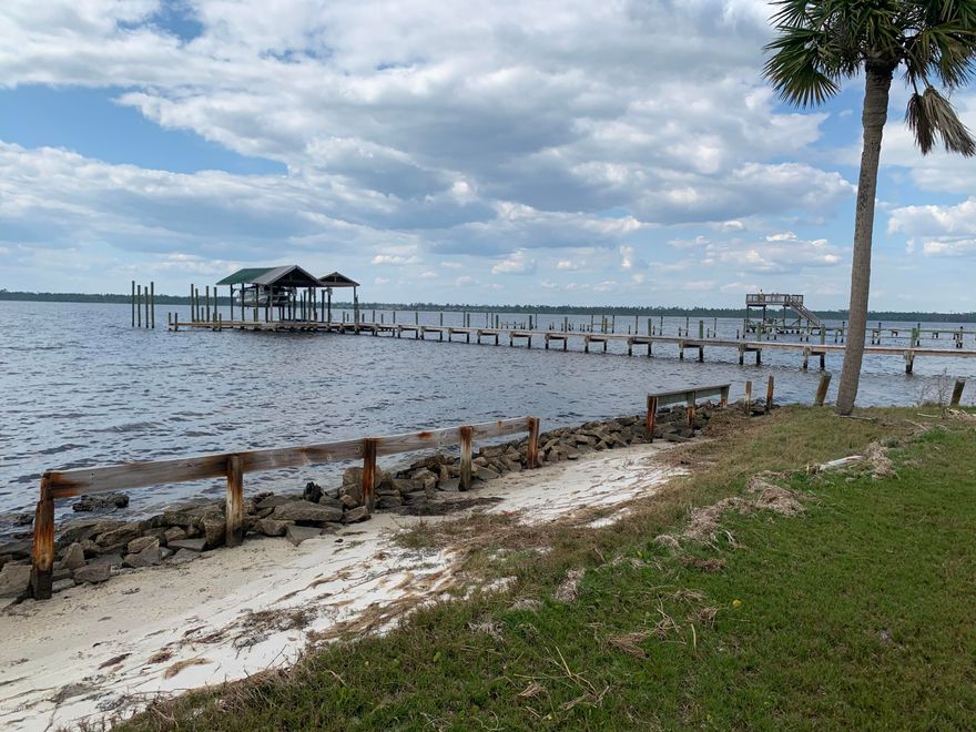 PRIME .79 acres of waterfront property in well sought after Lynn Haven.  This waterfront property consists of several lots that could possibly be split into to two 50' wide waterfront lots.  The property is just a few lots over from A.L. Kinsaul Park which features a pavilion, splash pad, dog park and yearly 4th of July fireworks.  This amazing lot has a natural beach shoreline with no marsh or wetlands and is sunset facing out your back door.  When looking for waterfront property to build your dream home on, this is the best of the best.  Do not miss out on this land.  Properties like this, in this type of location are few and far between.  May be a possibility of two 100x172 lots.  Refer to Lynn Haven building department