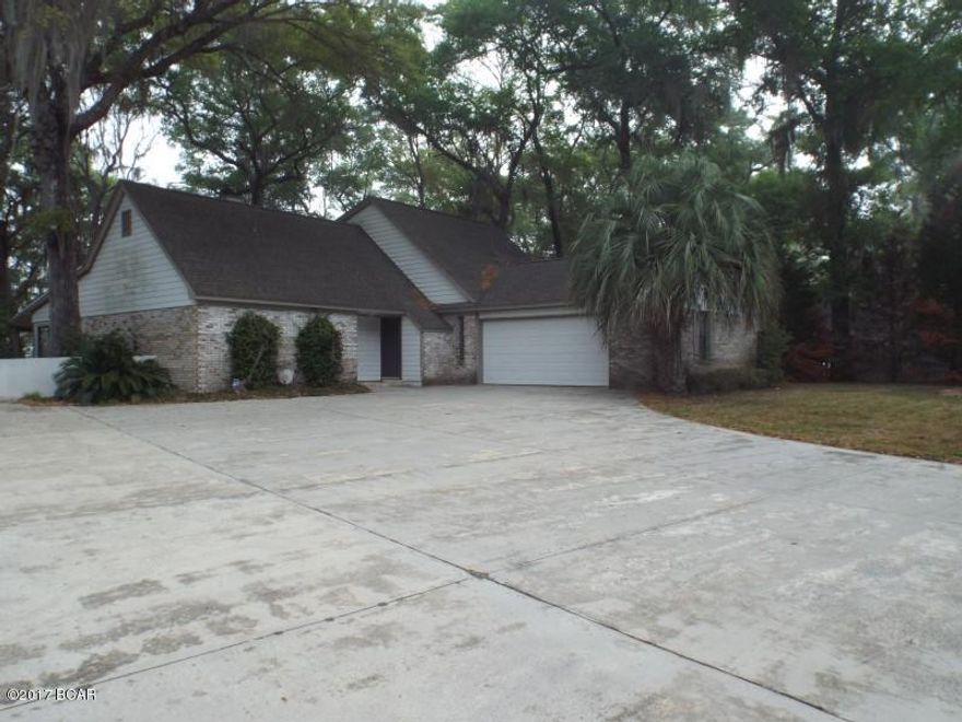 Four Bedroom four bathroom home that has a waterview in almost every room of the house offered as is. The property needs some TLC, the exterior features include a large driveway, outside storage building, multiple fruit trees,  back porch spanning the width of the house,a two story dock with covered boat storage on bottom level along with fish cleaning station on the top.  All sizes are approximate, please verify accordignly