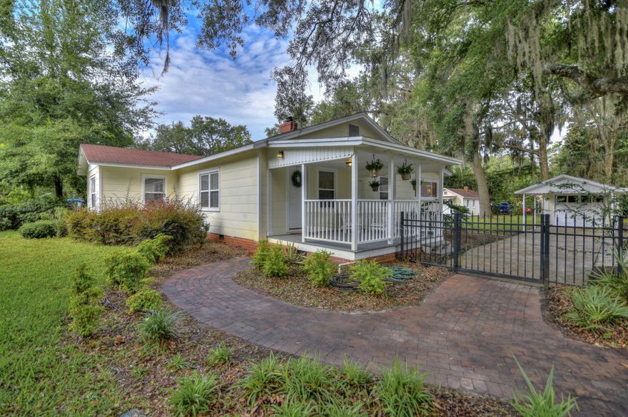 Beautiful historic Cove home that sits on top of the hill boasts magnificent original hardwood floors and exquisite solid wood stained doors in every room! This pretty Cove charmer has the original features that make the Cove such a desired community to live in. Notable features include custom one-inch wood blinds, new AC/Heat in 2017, wood burning fireplace, and renovated bathroom with classic subway tile. Oak trees grace the oversized double lot! Park your motorhome or boat in this expansive driveway with 30 amp power and gated ally access with entrance from either the front or rear of the home. The .62 acre yard is enclosed with black aluminum fencing and detached garage. Detached cottage provides additional living space perfect for a man cave or game room, with laundry room and bath. ***All measurements and important data must be verified if important.