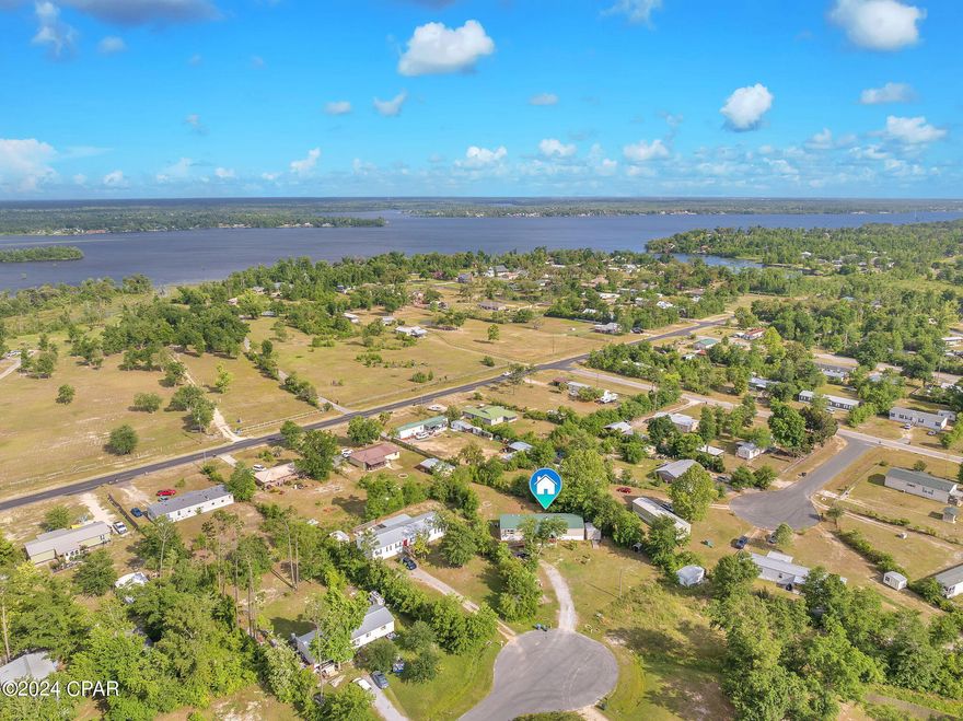 BACK ON MARKET AT NO FAULT OF SELLER! ALL NEW Vinyl Plank FLOORING & Carpet installed throughout! Great investment opportunity in the Deer Point area! Metal 40-year roof installed in 2019. The home is situated on half an acre at the end of a cul-de-sac. Spacious floor plan with over 2,000 square feet, this is a deal! 4 bedrooms, 2 full baths and two living room areas with a wood-burning fireplace in between. Large, covered front porch to sit and enjoy the Florida sun with fruit trees to harvest and plenty of open space for a garden. Bonus 10x12 shed with electric and insulation already in place! This is a great property with TLC, it would make for an ideal investment or primary residence.