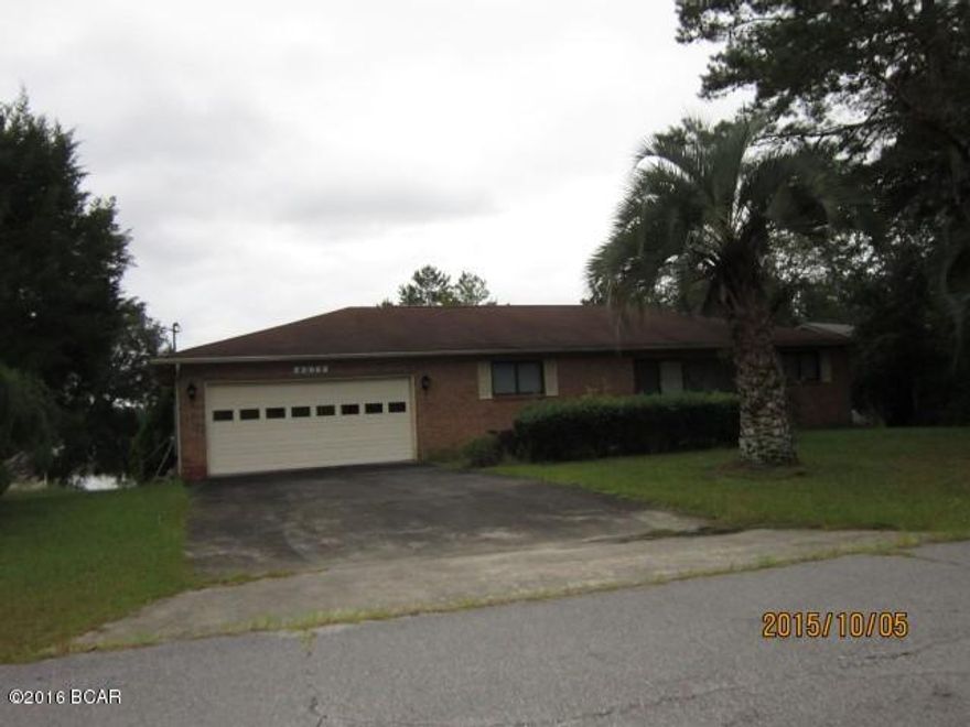 PRICE REDUCED!!! WATERFRONT ON BOAT LAKE!!! Brick, three bedroom, two and a half baths, Kitchen with breakfast bar, dining area, large living room, large sunroom overlooking Boat Lake, with deck off sunroom, nice office or computer room with 1/2 bath. Down stairs you will find a 12 x 23 bonus room for guests or play room, also overlooking Boat Lake. Patio at ground level on back of house. House features a two car attached garage, trees and landscaping. This house and property has been well maintained and will qualify for any type of financing. Bring your prospects to see this one.