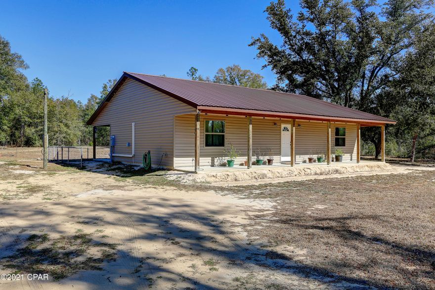 If you want peace and quiet this is your home!  This quaint new 2 bedroom 1.5 bath  open floor plan home is newly constructed and move in ready. Situated on 1.10 acres the home is surrounded by woods.  Highlights include metal roof, vinyl siding, vinyl plank flooring, kitchen pantry, walk in master closet, inside laundry,  large front and back covered porches, 24' x 20' shed, and 30 amp plug and drain for RV hookup.  There are two mini splits for heating and cooling.  Compass Lake in the Hills is a 10,000 acre master planned community showcasing the natural beauty of Northwest Florida.  The highlight is Compass Lake, a 600 acre natural spring fed lake.   The Compass Lake in the Hills Property Owners Association is a voluntary membership association that costs $135/ year.  The amenities include swimming pool, driving range, disc golf, boat rental, basketball court, tennis courts along with access to the private McCormick lake with a sandy beach and boat launch.  Go to CompassLake.org for more general information or www.compass-lake.com for the Property Owners Association.  All buyers must be pre-qualified by a mortgage lender to submit an offer.