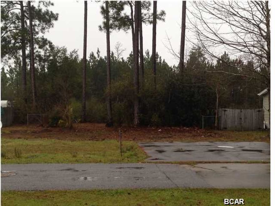 PERFECT LOT FOR A starter HOME ON THE BEACH. This lot is cleared and already has the hook ups in place, Located in a very NICE community with a divided paved road. This lot is ready! Lot is being sold AS IS.