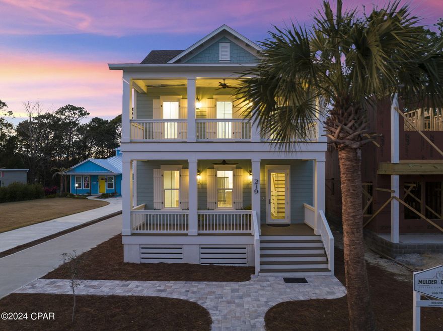 CURRENTLY UNDER CONTRACT, SELLER WILL CONSIDER BACKUP OFFERS. Experience coastal living expertly curated for a life of everyday indulgence. This new construction, timeless gulf-side estate offers a four-bedroom primary home, one-bedroom carriage home atop the two-car garage. As you enter the front door to the foyer, you will find Board and Batten walls and a stunning White Oak Stairway with V-groove (shiplap) walls illuminated by beautiful Chandelier and Wall Sconces. The adjoining family room also features Board and Batten walls as well as exposed ceiling beams. The expansive 13x13 dining room, adorned with an elegant hanging fixture, would generously accommodate a grand table and chairs, creating a lavish space for entertaining. The stunningly appointed kitchen features all of the accoutrements including KitchenAid appliances with a 36'' five-burner stove, quartz countertops, expansive island, floor-to-ceiling custom cabinetry, and a showpiece backsplash with handmade tile from Spain. Indulge in the ambiance of the master bedroom, where regal Board and Batten walls set the tone. The ensuite bathroom, adorned with a separate water closet, extra-large vanity with dual sinks, and a generously sized tiled walk-in shower with shower system.  Tankless water heaters in both homes provide continuous hot water on demand. The master bedroom adorns a spacious 11x8 walk-in closet boasting bespoke custom built-ins.
Additional features of the primary home on the second level include another bedroom with a wall of windows and a sleek ensuite with tile backsplash, custom cabinets, single vanity, and a hexagon tiled walk-in shower. The third and fourth bedrooms on the second level exude the continuity of sophistication throughout the house with board and batten walls, custom-built closets and generously sized bedrooms. The fourth bathroom in the primary home on the second floor is adorned with a tub and shower combination and elegant floor-to ceiling tiles and a single vanity with a charming mirror.
A flagstone walkway leads from behind the main house past intricately placed foliage to the well thought carriage home. The carriage home offers spaces finished as exquisitely as the primary home with a large kitchen and customs cabinetry, quartz countertops, and a large island which opens to the living area. Custom woven window treatments are installed throughout the carriage house. The expansive bedroom is large enough to accommodate a king size bed. The luxurious ensuite is incredibly spacious with a large vanity, walking in shower, water closet, and laundry with a stackable washer and dryer. Beneath the carriage house you will find a two-car garage and plenty of storage space for essentials. Within the rear grounds of the carriage house, a 9x8 shed awaits, providing a tasteful storage solution. Additionally, there is ample open space, inviting the possibility of incorporating an in-ground pool should you desire to enhance this already enchanting space. The landscaping surrounding the carriage house showcases a lush array of indigenous flora, including live oaks, fragrant rosemary, vibrant beautyberry, and aromatic jasmine, creating a verdant haven of natural beauty. Owners and their guests can enjoy an unparalleled location only a five-minute walk to the beach and five-minute drive to shopping, dining, and activities of both 30A and Pier Park. Laguna Beach prides itself with a .7 mile long Reserved Beach and unconstrained limits by any HOAs or restrictive community guidelines. Built to the highest standards, this private retreat allows for an exceptional coastal life with all of the amenities.