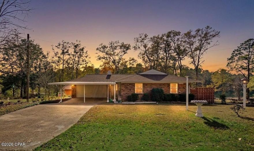 Welcome to your private waterfront retreat in the charming community of Dogwood Lake Estates--where space, versatility, and scenic beauty come together.

Situated on approximately 1.37 acres +/-, this well-maintained brick home offers 3 bedrooms and 2 bathrooms with a flexible, multi-level layout designed to accommodate a variety of lifestyles. Whether you're looking for a primary residence, multi-generational living, or income-producing potential, this property delivers.

Upstairs, you'll find a thoughtfully designed semi-open floor plan featuring a well-appointed kitchen that flows seamlessly into the dinette and living area--perfect for everyday living and entertaining. Two spacious bedrooms and a full bath complete the upper level. French doors lead out to an expansive deck overlooking the lake, offering a peaceful setting for morning coffee or evening relaxation.

The lower level expands your living options with a fully functional second living space. Complete with its own private entrance, this area includes a large living room with a fireplace, a second kitchen, a third bedroom, and a full bath. French doors open to the backyard, creating an ideal setup for guests, in-law quarters, or a potential rental unit.
Additional highlights include:

Attached garage conveniently located off the foyer, featuring built-in cabinetry, utility sink, and washer/dryer setup
Detached block building with garage door--perfect for workshop or equipment storage
Additional storage building near the water for all your lake gear
Expansive yard offering privacy, room to roam, and direct lake access

Located in the quaint and desirable Dogwood Lake Estates community, residents enjoy access to lakes, a golf course with clubhouse, and the added benefit of no HOA. All of this just a short 6-mile drive to Bonifay for shopping, dining, and everyday conveniences.

This is a rare opportunity to own a waterfront property with space, flexibility, and endless potential. Schedule your private showing today and experience lake living at its finest. Schedule your private showing today!