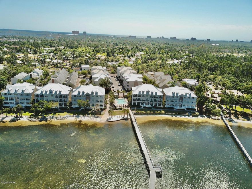 Reward yourself with this beautiful luxury condo. The gated Bay Front community of Waterhaven is conveniently located for shopping, dining, entertainment and the white sandy beaches. Highlights include hardwood floors throughout the main living areas, crown molding throughout, tray ceilings and stylish columns will have you feeling larger than life. Natural light flows throughout this unit with over 1,600 sq.ft of sprawling entertaining spaces you'll enjoy the perfect setting for relaxing and entertaining. The spacious kitchen is certain to bring out your inner chef. With granite countertops, viking gas stove, sub zero refrigerator, wine cooler and breakfast bar that opens up to the great room/ breakfast area. You'll love the space the master bedroom provides and the large walk in closet. The master bathroom has his and her sinks, a large soaking tub and a seperate shower. The two additional bedrooms also provide plenty of comfortable space for sleep, study and storage. Keeping convenience in mind the home has a full size laundry room and a storage closet outside of the unit. The many amenities include, a dock with marina for fishing or relaxing in the evenings, community pool, kayaking, paddle boards, club house, fitness center and theater. You'll appreciate the value this unit and community offers. Call today to set up your showing.