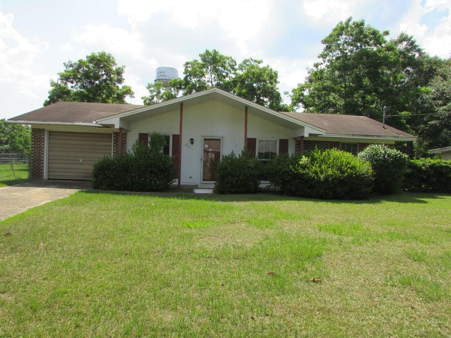 Brick house in Bonifay close to Shopping and Interstate! 3 Bedroom 1.5 Baths with 1320 sq ft with 1 car attached garage. Central A/C, Ceiling fans. Home needs some TLC but could make the perfect home for your family!  Located on a 1 acre fenced lot with Storage Building and carport.  Nice manicured lot with plenty of room for the kids to play! Being sold AS-IS. This home will not last long so call today for your personal viewing!