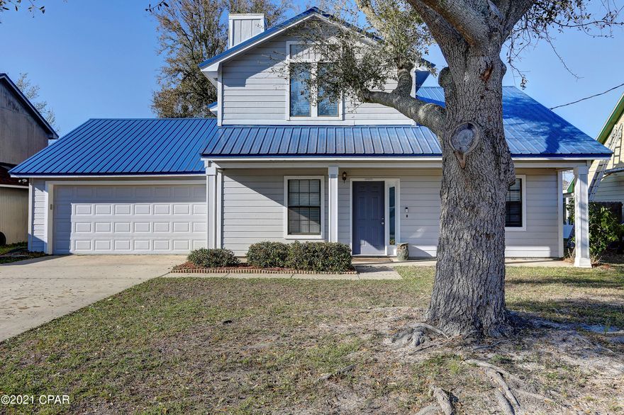 Charming 3 bedroom 2 bath split floor plan home centrally located in the heart of Lynn Haven.  Home offers a very open floor plan,  upgraded ceiling fans and light fixtures, natural stone wood burning fireplace, LVP and tile flooring, new metal roof and freshly painted and so much more.  The cook in the family will love this wonderful kitchen with solid surface counter tops, breakfast bar and plenty of counter space for prep work, the kitchen overlooks the wonderful backyard.  Private master suite complete with a sitting area, walk in closets, double vanities, other bedrooms are very spacious and offer plenty of storage.  You will enjoy the screened back porch which opens to the lovely back yard which is the perfect setting for all of your family cookouts and outdoor activities. All ages, sizes including sq. ft. are approximate measure if important.