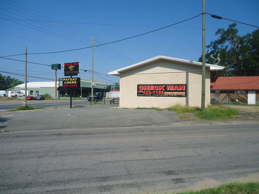 Corner Lot and Building on Hwy 90/Lafayette St and Bumpsnose Rd. Parking front and rear and side. Last used as a Check Cashing Store.  High Visability and traffic count with a traffic light.  Many uses and a must see.