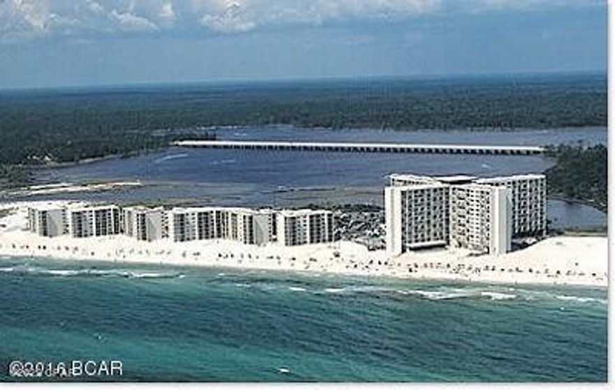 CURRENTLY UNDER CONTRACT, SELLER WILL CONSIDER BACKUP OFFERS Gulf-front two bedroom unit in Pinnacle Port's Tower building; beach-themed decor, fully furnished and ready for your enjoyment or as a vacation rental.  The unit features a fully-equipped kitchen, half bath/laundry, two balconies, two bedrooms upstairs and two baths.  The master bedroom upstairs has an ensuite bathroom and its own balcony.  Pinnacle Port Resort is situated on a 25+ acre site within a beautiful gated community having over ¼ mile of beach frontage!  The complex has lots of amenities including two swimming pools, tennis courts sauna/steam room, fitness room, its own private freshwater dock with boat slips boat launch and wi-fi.   Continued....lease note that the Association fees include electricity for heating, cooling and hot water.  The owner pays a small electricity bill for lighting and appliances.