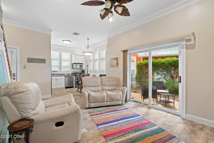 Welcome to Coral Bay Village! This freshly painted 3bd/2bth END unit has a ground floor master bedroom with a private patio. Open floor plan features wood look tile flooring downstairs, beautiful eat in kitchen with lots of cabinet space and stainless-steel appliances.   Side patio off the living room is a great place to grill and enjoy the Florida weather. Upstairs offers 12' ceilings in the front master bedroom with Juliet balcony and Jack and Jill bathroom shared with the third bedroom. The Key West style architecture and the private pool of Coral Bay Village makes this quaint 16 unit community with brick paver streets and lush landscaping, very inviting. This golf cart friendly community is only blocks from the beach and only a few minutes to Carillon beach, 30A corridor and is only minutes to Pier Park. 
New A/C, furnace, and water heater in 2020. New Refrigerator 2020 All sizes/info/measurements approximate; please verify if important!