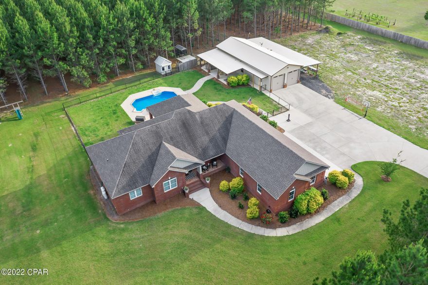 UNDER CONTRACT-TAKING BACK UP OFFERS!  Check out this absolutely beautiful secluded custom built 3/2 brick home built in 2015 located on 10 acres.  It comes with a 24X24 man cave, 24x36 shop, 16x36 lean to where hot tub is located and a 16x60 lean to on the other side.  Outdoor living has a in-ground pool, 25X20 covered porch and a nice stocked fish pond.  The home and property are breath taking.  Home has a open floor plan,  huge master bedroom, master bathroom and walk in closet. Living room has built in bookcases and a propane fireplace. Office has a built in safe. Everything is built to a higher standard in this home.  Check it out!