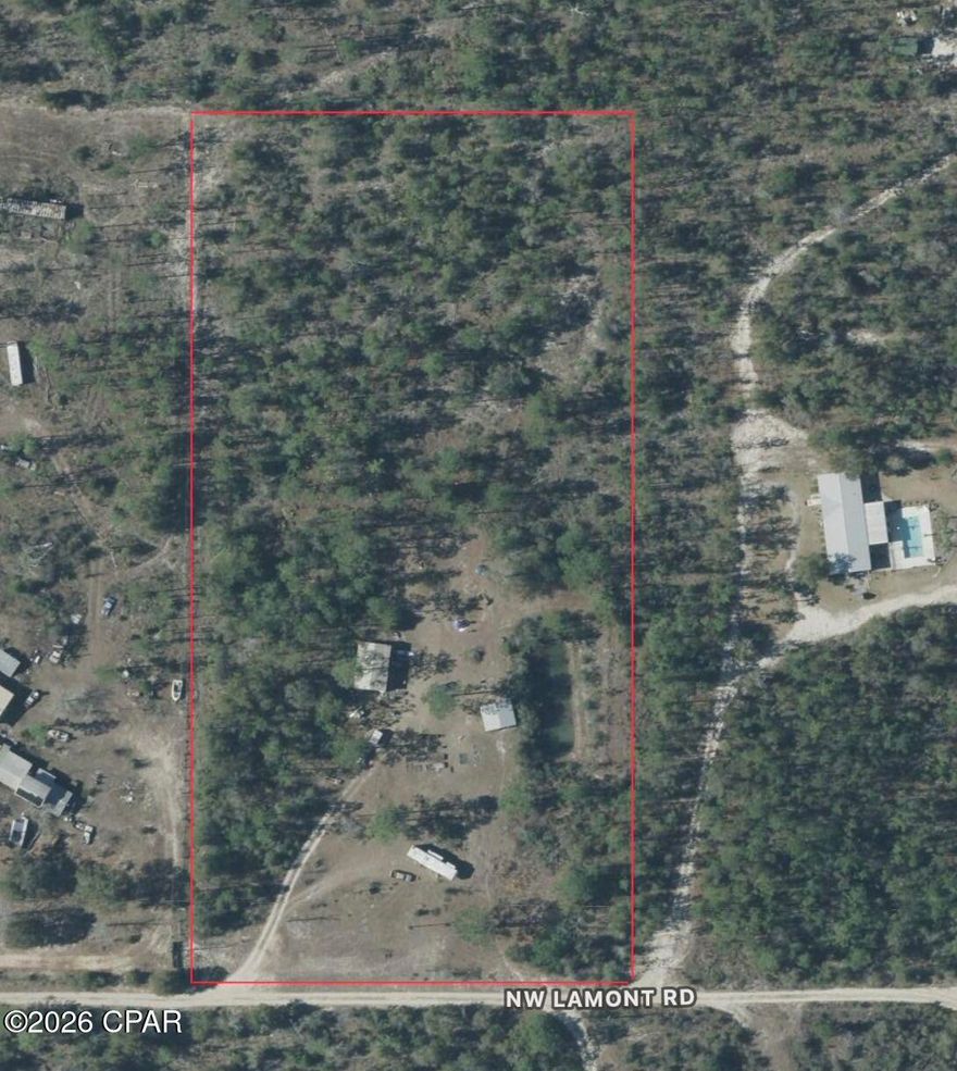 Beautiful and extremely private 5-acre property in Fountain, FL, featuring a perfect blend of cleared and wooded land. The property offers full-time RV hookups with electric, water, and sewer already in place, along with a tiny home/shed and a 20x30 enclosed pole barn for storage, equipment, or workshop use. Established deer feeders and trails make this an ideal hunting camp, while the seclusion and utilities also lend well to off-grid living. Plenty of room for ATVs, recreational use, or future improvements. A rare opportunity for those seeking privacy, outdoor recreation, and country living.