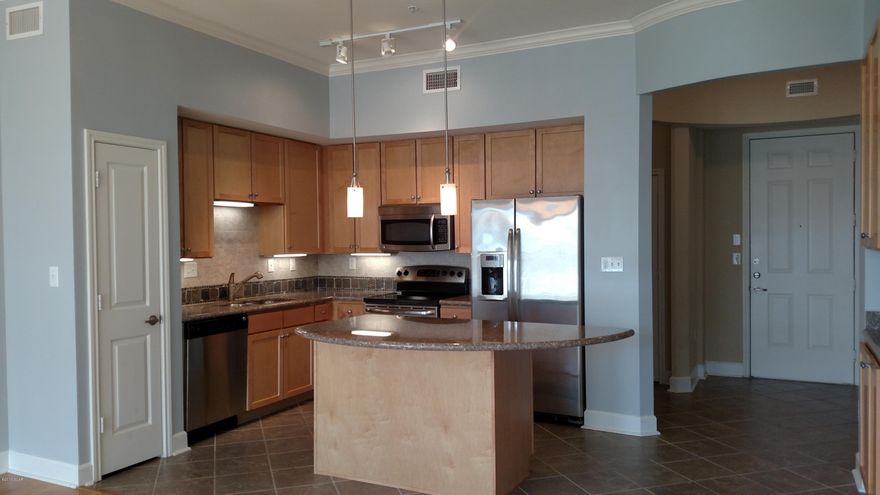 Move-In Ready with Courtyard/Pool Views. Experience an oasis at the beach. This is a 1 bedroom condo w/study. Features include hardwood flooring in the main living/dining area, tile in the foyer, hall, laundry, bath, and carpet in bedroom, walk-in closet and study. The well appointed kitchen includes granite island and countertops, stainless appliances, and wood cabinetry. This condo also has a washer and dryer, blinds throughout, private balcony, and covered entry. Bathroom boasts garden tub and dual vanities. Water, sewer, and garbage included. Pets are not allowed. Island Reserve is a highly-sought-after gated community loaded with amenities, including resort pool with zero entry and waterfall, indoor sports court, fitness center, gameroom and theater.